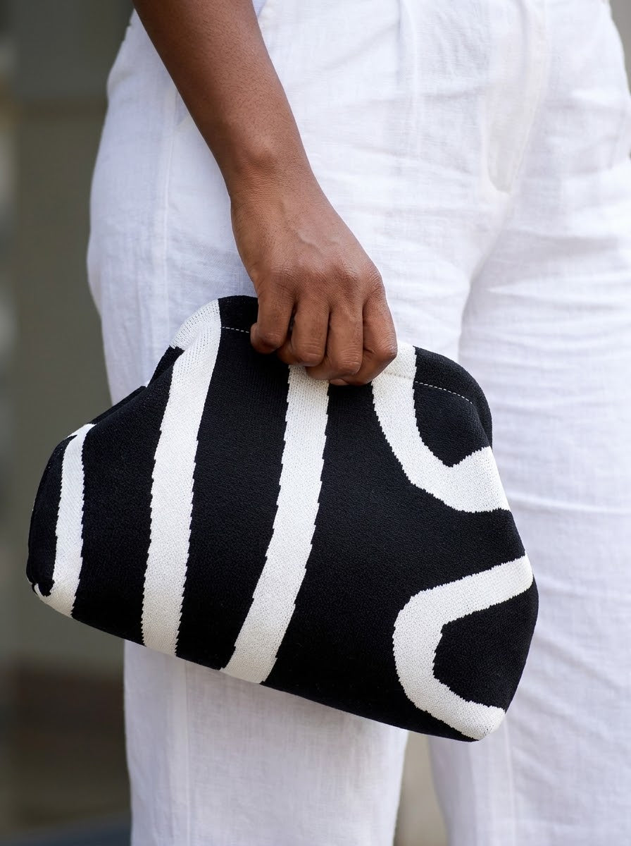 Close-up of the knit clutch in hand