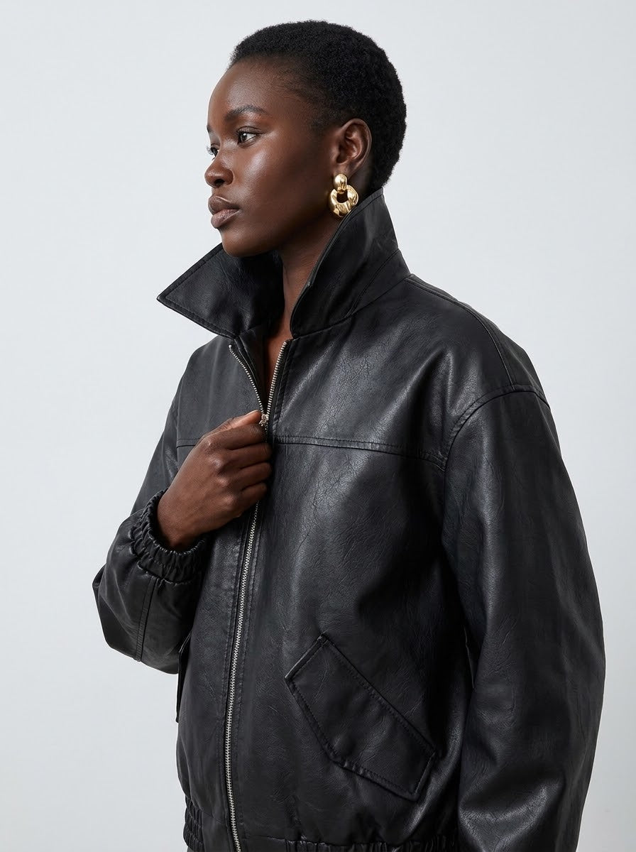 Model wearing the black Oversized Faux Leather Moto Jacket